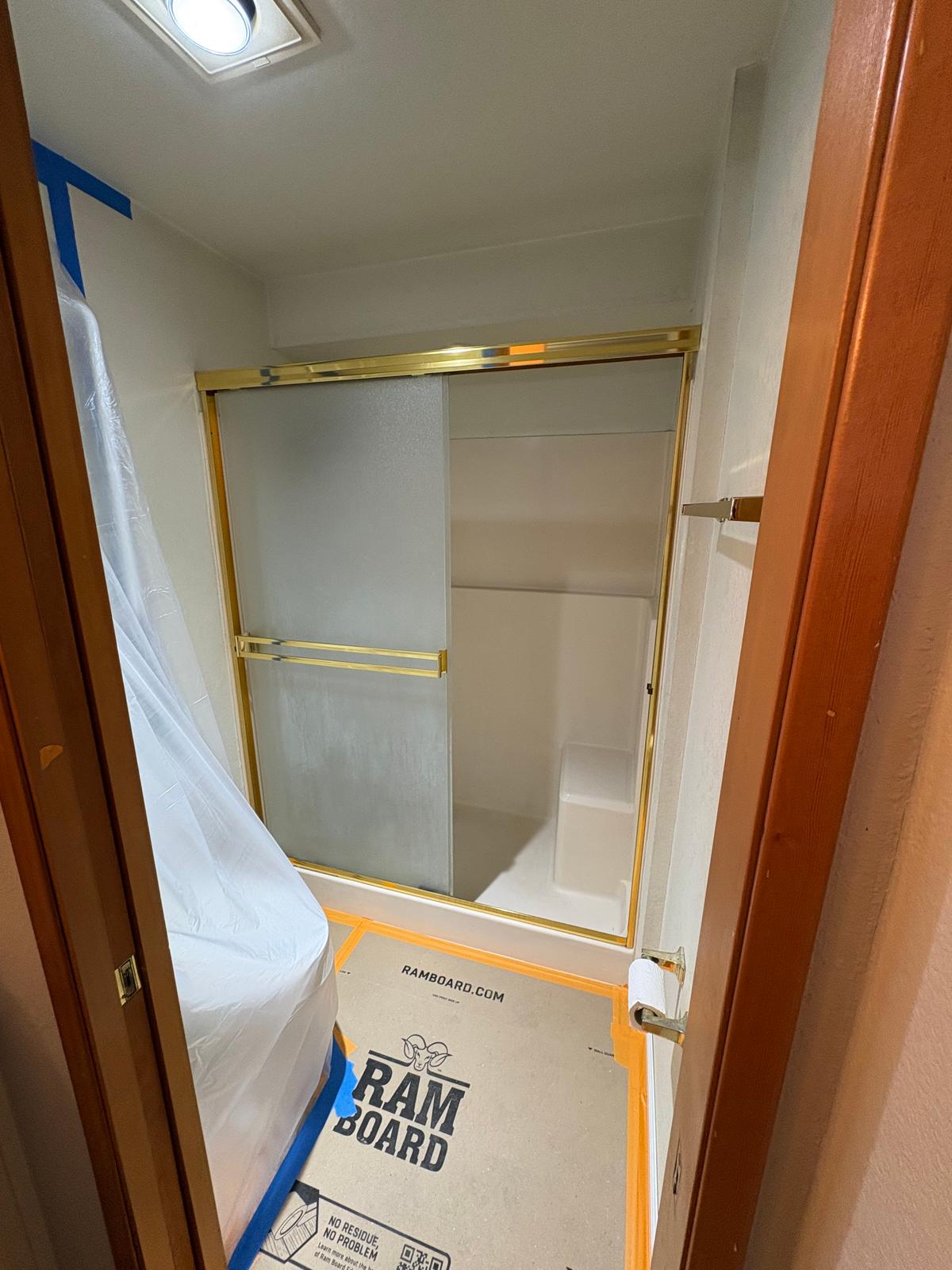 Original shower → new walk-in shower, before